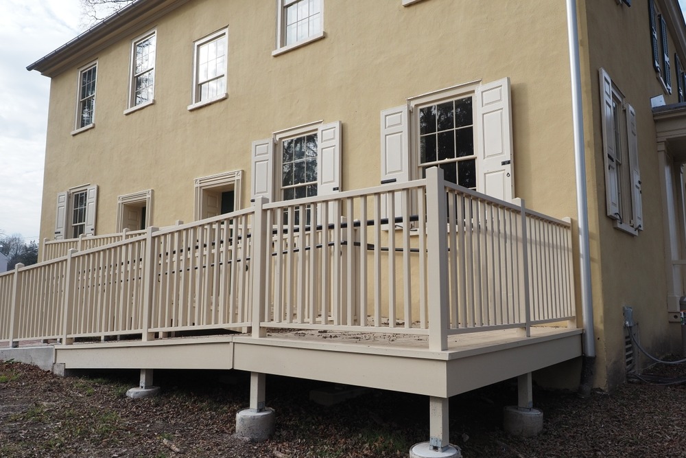 When to Invest in Elevated Decks to Address Sloping Terrain and Improve Drainage